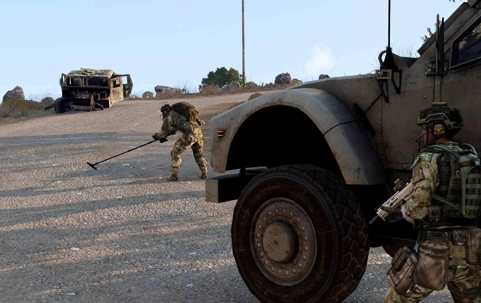 An EOD clearing a convoy's way with a mine detector.